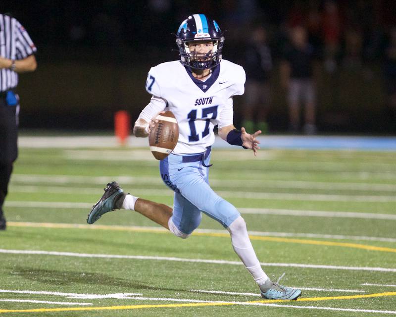 Downers Grove South's Aldan Kanazawa looks to throw for a gain against Willowbrook on Friday, Sept. 20, 2024 in Villa Park.