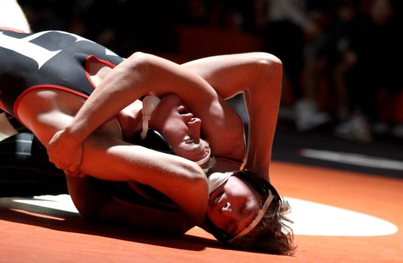 Crystal Lake Central’s Cayden Parks, bottom, battles Huntley’s Wyatt Theobald in a 190-pound bout in varsity wrestling at Crystal Lake Friday.  Parks won the match.