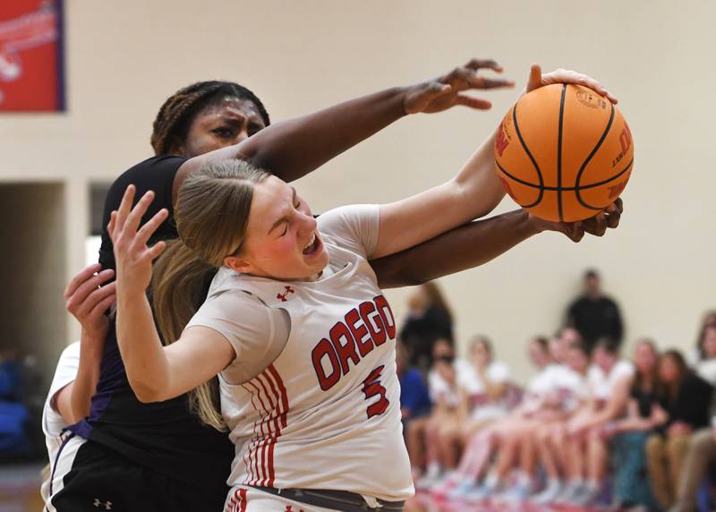Oregon's Shaylee Davis (5) and Rockford Lutheran's Danielle Larson (24) fight for a rebound on Saturday, Jan. 24, 2026 at the Blackhawk Center in Oregon.