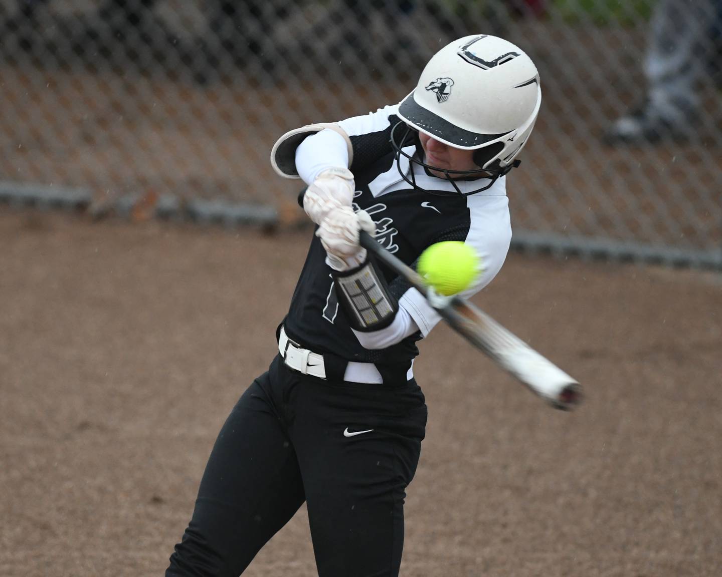 Kaneland Kailey Plank (1) makes contact with the ball on Saturday April 29th while traveling to take on DeKalb at DeKalb High School.