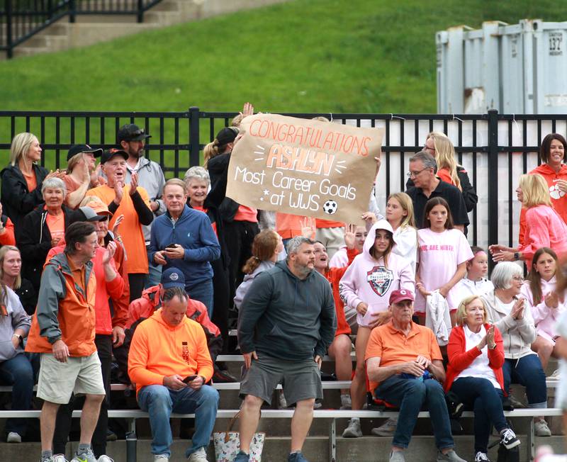 Wheaton Warrenville South fans celebrate Ashlyn Adams during the Class 3A Glenbard West Sectional final against St. Charles North on Friday, May 30, 2025 in Glen Ellyn.