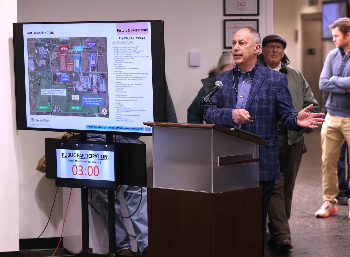 DeKalb developer Jerry Krusinski of ChicagoWest Business Center, which is petitioning for city support to rezone and annex 560 acres of land for Endeavour Energy to build a major, multi-building data center, speaks on Monday, Dec. 1, 2025, during the city's Planning and Zoning Commission hearing at the DeKalb Public Library.