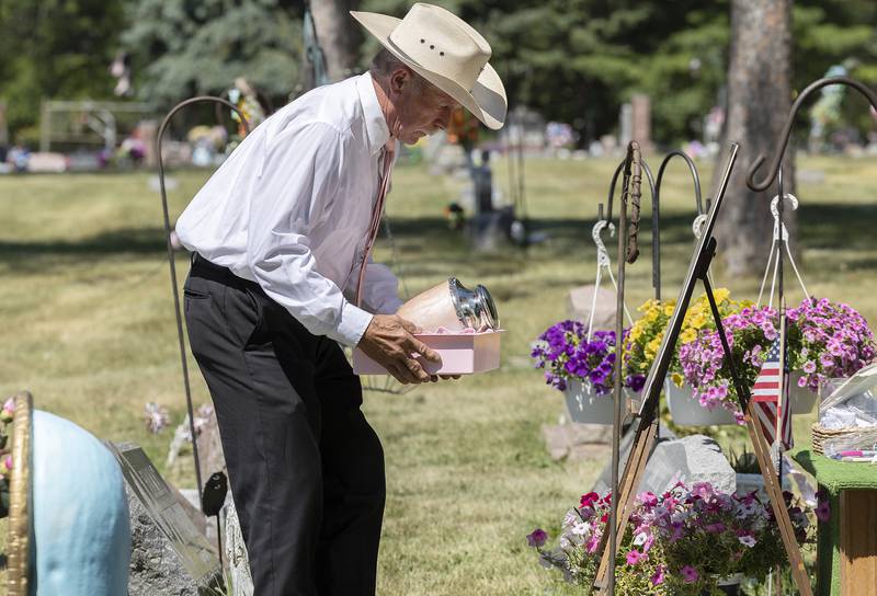 Mark Smith brings the cremains to their final resting place Friday, July 7, 2023.