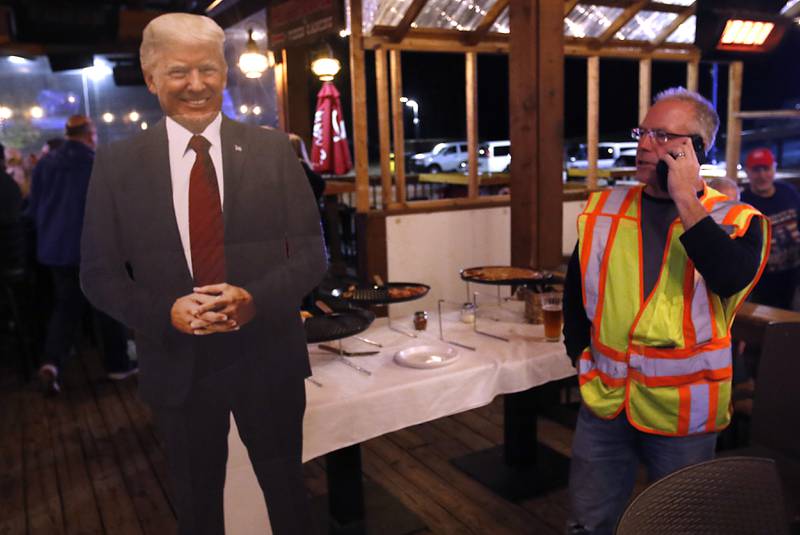 A cardboard cutout of Donald Trump was on hand during a GOP election results watch party in Woodstock on Tuesday, Nov. 5, 2024. State Sen. Craig Wilcox stopped by during a break from removing campaign signs.