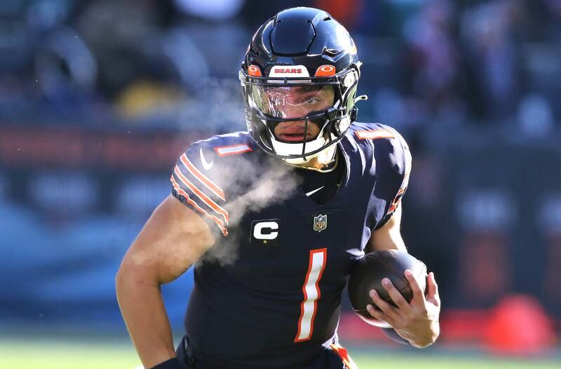 Chicago Bears quarterback Justin Fields carries the ball during their game against the Eagles Sunday, Dec. 18, 2022, at Soldier Field in Chicago.