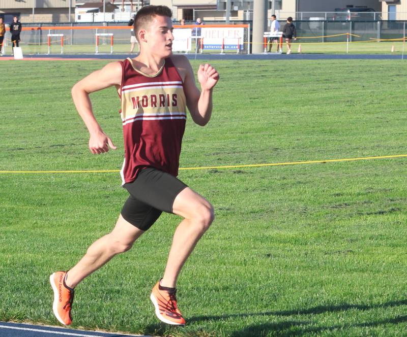 Morris's Cuyler Swanson runs toward the finish line of the 3200 meter run during the Class 2A Sectional on Wednesday, May 20, 2026 at Pontiac High School.