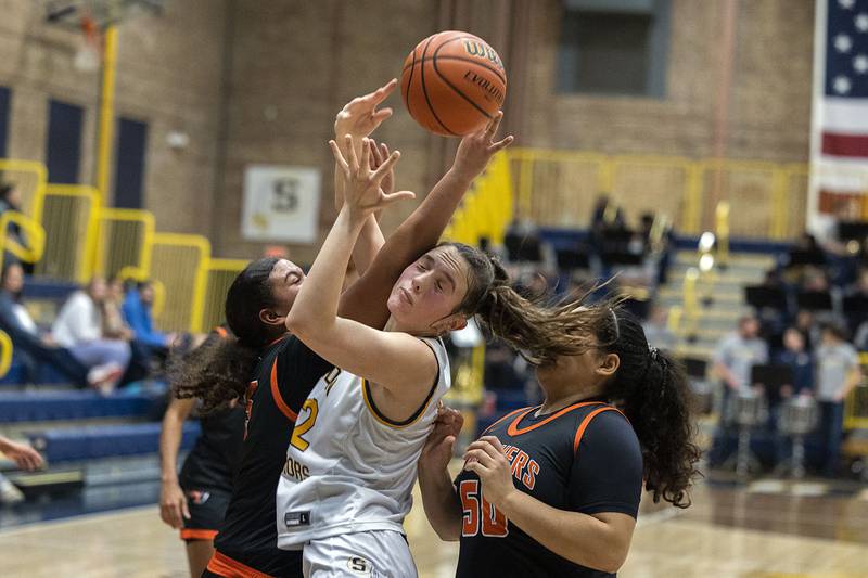 Sterling’s Madison Austin works below the basket against United Township Thursday, Jan. 19, 2023.