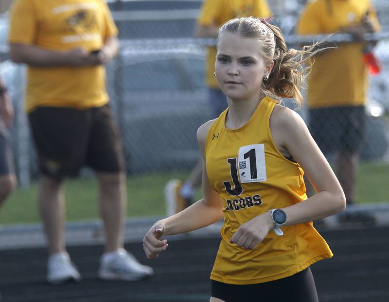 Jacobs’ Lennox Szymonik competes in the 3200 meters run on Thursday, April 23, 2026, during the McHenry County Track and Field Meet at McCracken Field in McHenry.