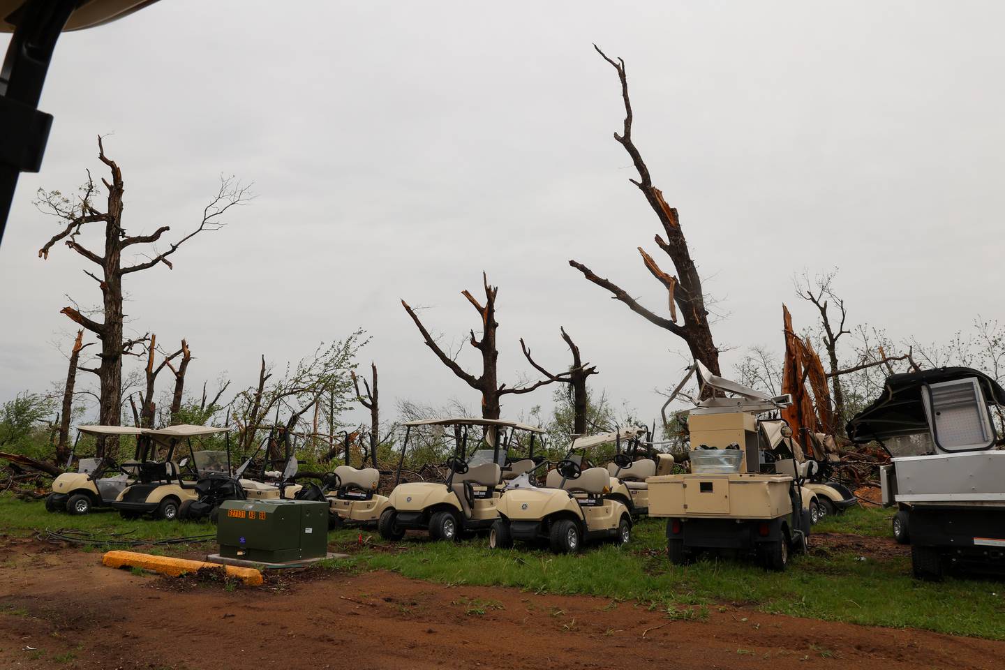 Damaged carts are parked at the Kankakee Elks Country Club on April 27, 2026, following the March 10 tornado that hit Aroma Township, including the longtime golf course.