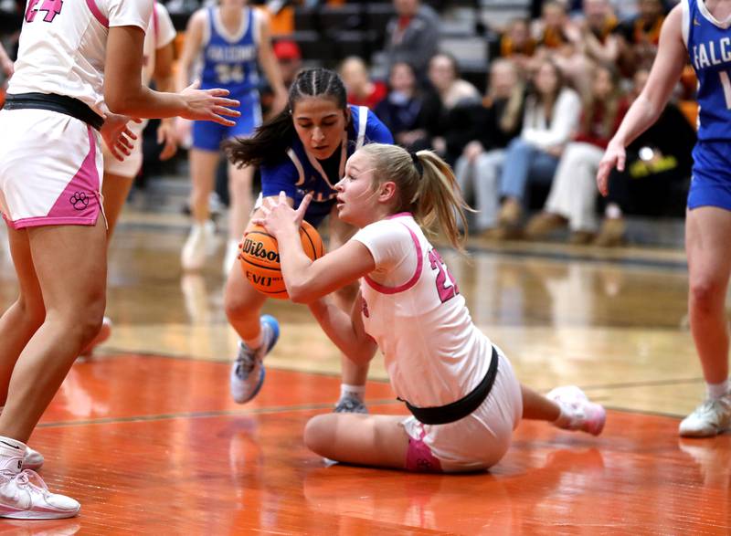 Batavia's Ali Thomas (on ground) grabs a loose ball from Wheaton North's Sara Abdul during a Class 4A St. Charles East Sectional semifinal on Tuesday, Feb. 25, 2025 in St. Charles.