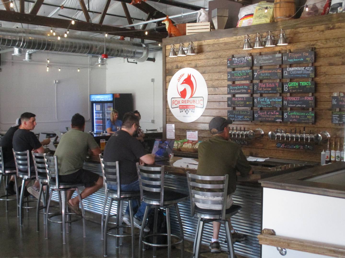 Fox Republic Brewing features 17 taps with beers designed to appeal to every taste. Patrons are seen here enjoying their drinks at the bar on July 28, 2023.