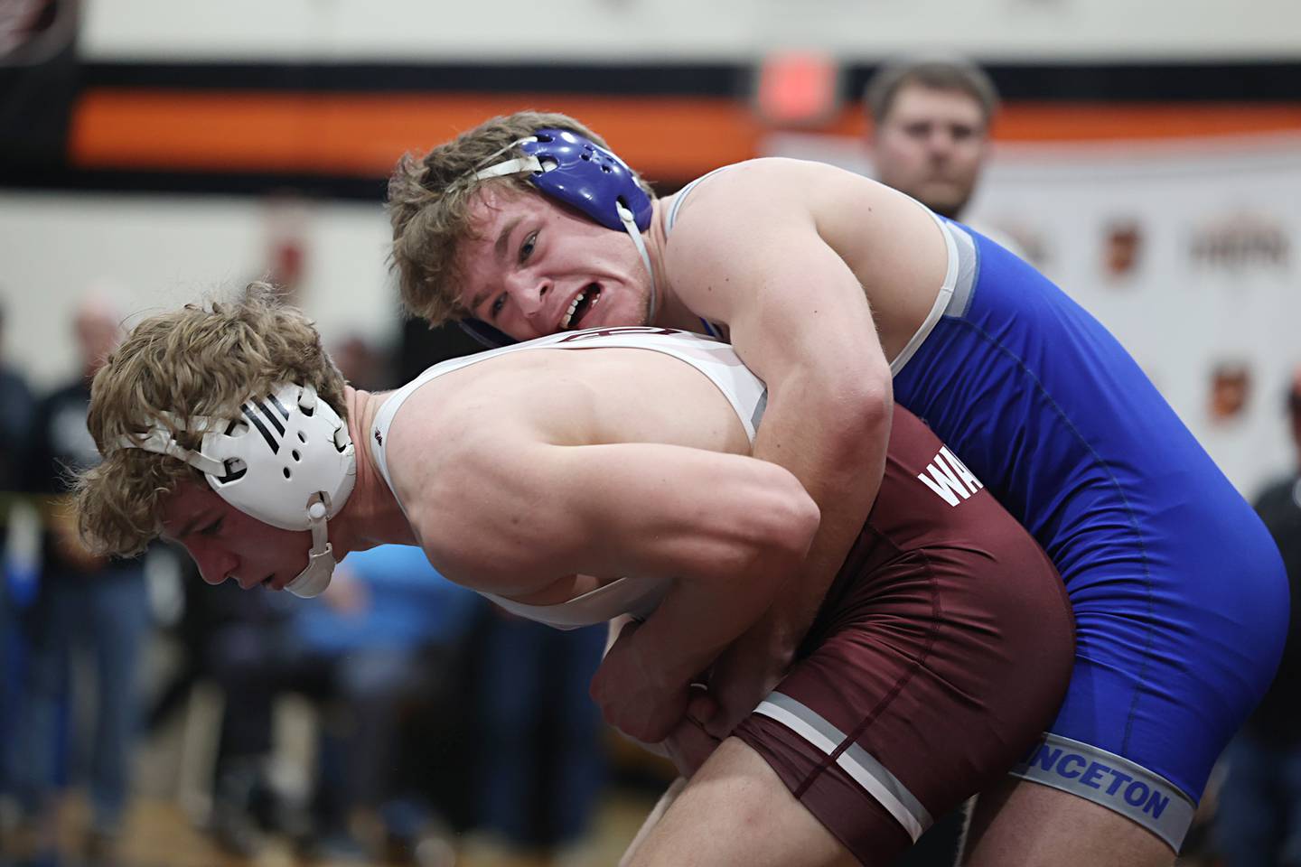 Princeton’s Casey Etheridge grabs West Chicago’s Tyler Jones in the 165 pound first place match Saturday, Feb. 14, 2026, during the Class 1A wrestling sectionals in Byron.