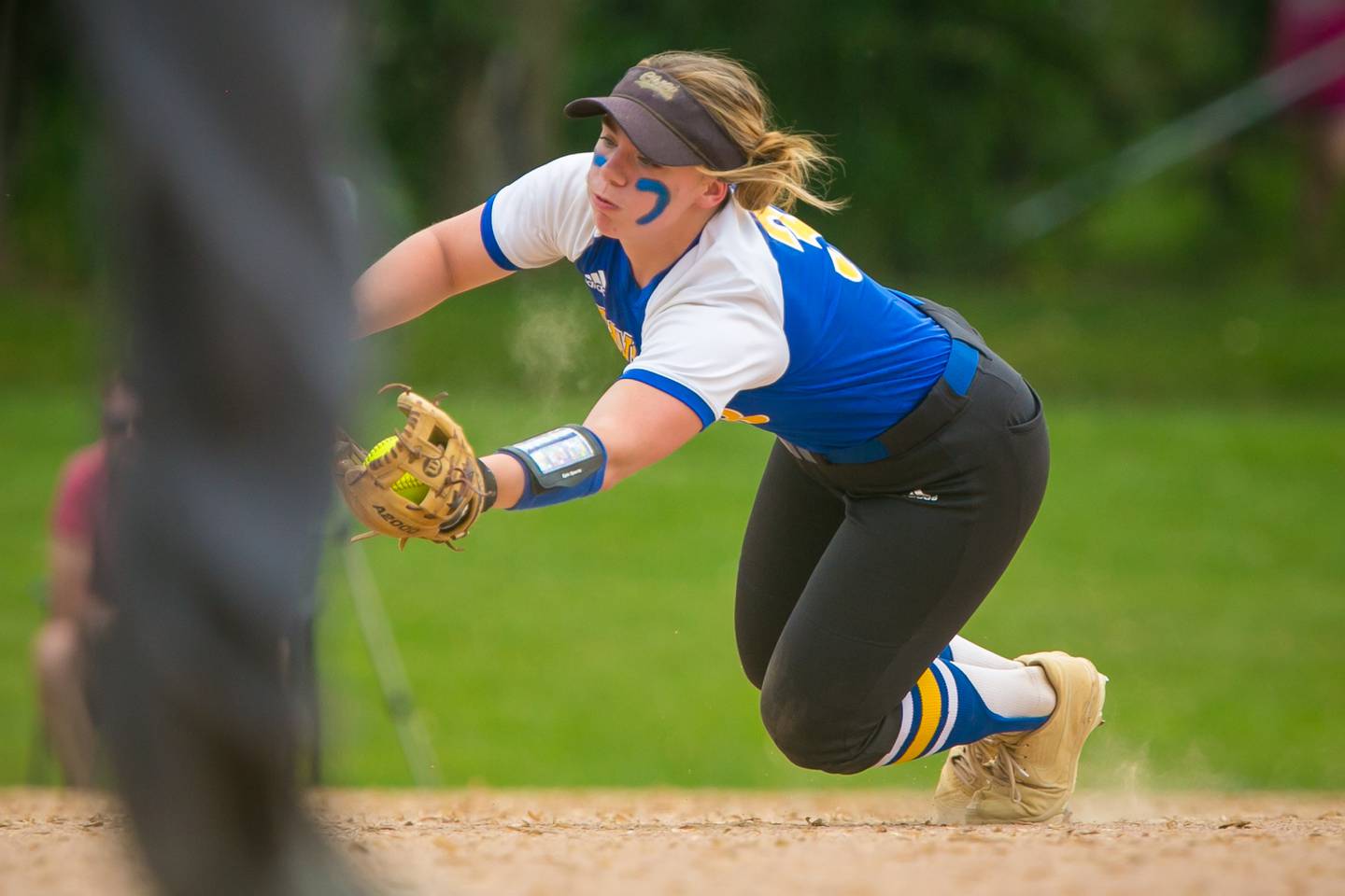 Johnsburg shortstop Brooke Klosowicz (3) makes a diving catch in the second inning of the game at Richmond-Burton High School on Monday, May 24, 2021, in Richmond, Ill. The Skyhawks won, 7-1, and stay undefeated in KRC at 7-0.