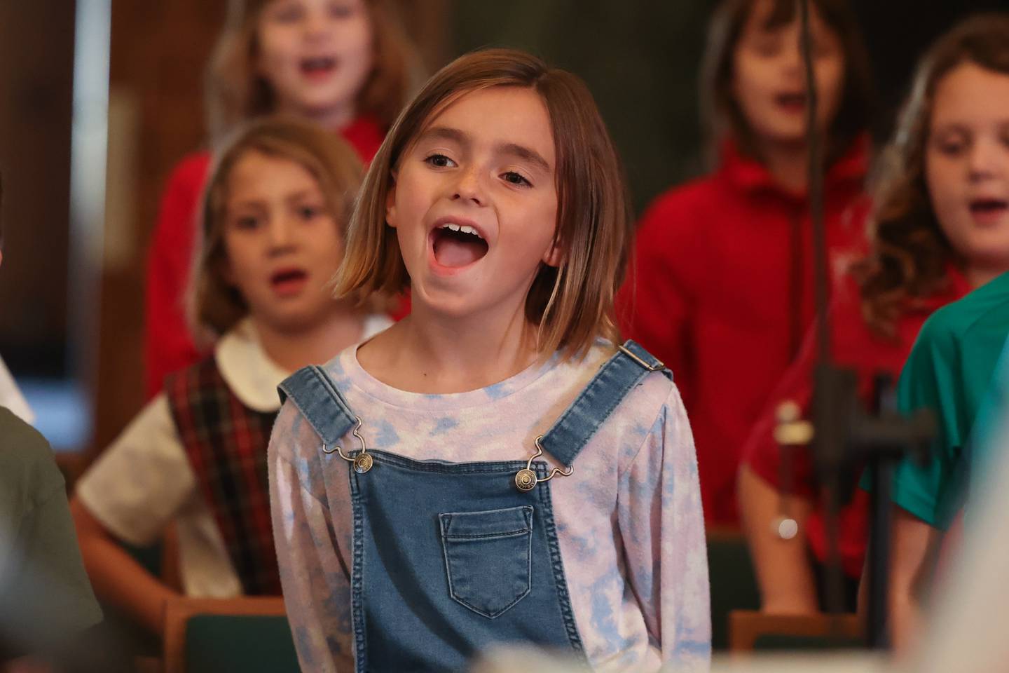 Julia O’Connell sings at the children’s choir rehearsal at the Cathedral of Saint Raymond Nonnatus for the upcoming A Very Rialto Christmas show.