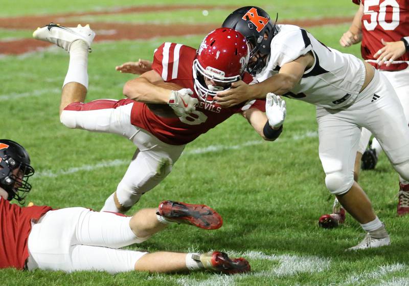 Hall's Braden Curran is taken down by Kewanee's Benjamin Taylor on Friday, Sept. 27, 2024 at Richard Nesti Stadium.