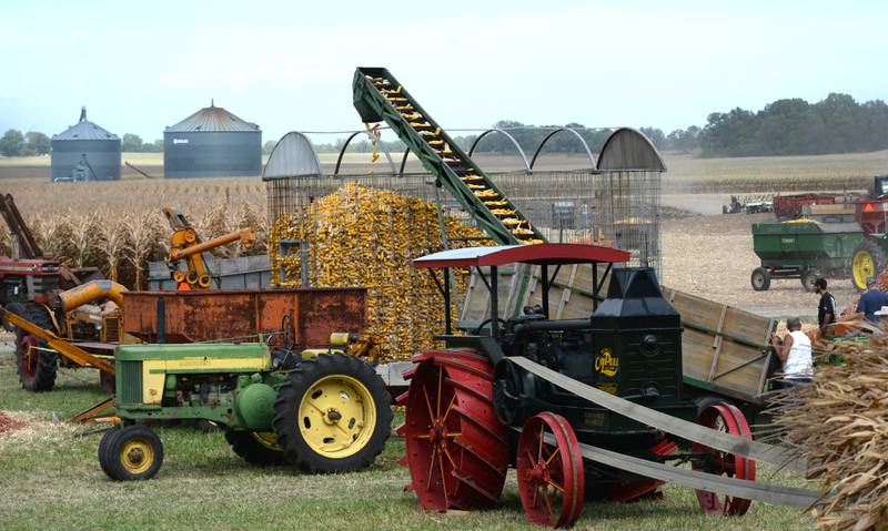 Antique tractors and other vintage pieces of farm machinery were put to use at the Bos Bros. Historical Farm Old Fashioned Fall Harvest south of Erie on Saturday, Sept. 21, 2024.