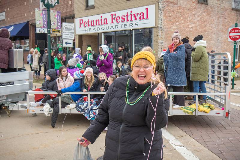 Debbie Bay of Dixon, gets covered in Silly String during Dixon's St. Patrick's Day parade on Saturday, March 18, 2023.