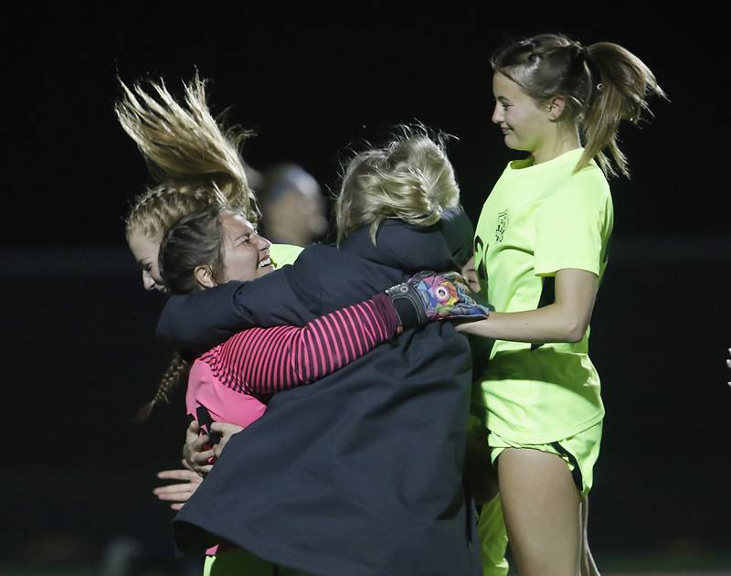 Richmond-Burton's Taylor Labay celebrates with her teammates after winning the Kishwaukee River Conference Girls Soccer Tournament Championship Match Wednesday, May 3, 2023, at Richmond-Burton High School.