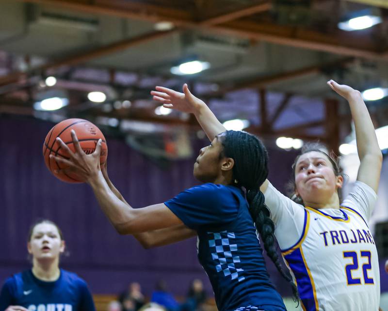 Downers Grove South's Hayven Harden (4) put up a shot during girls basketball game between Downers Grove South at Downers Grove North. Dec 16, 2023.
