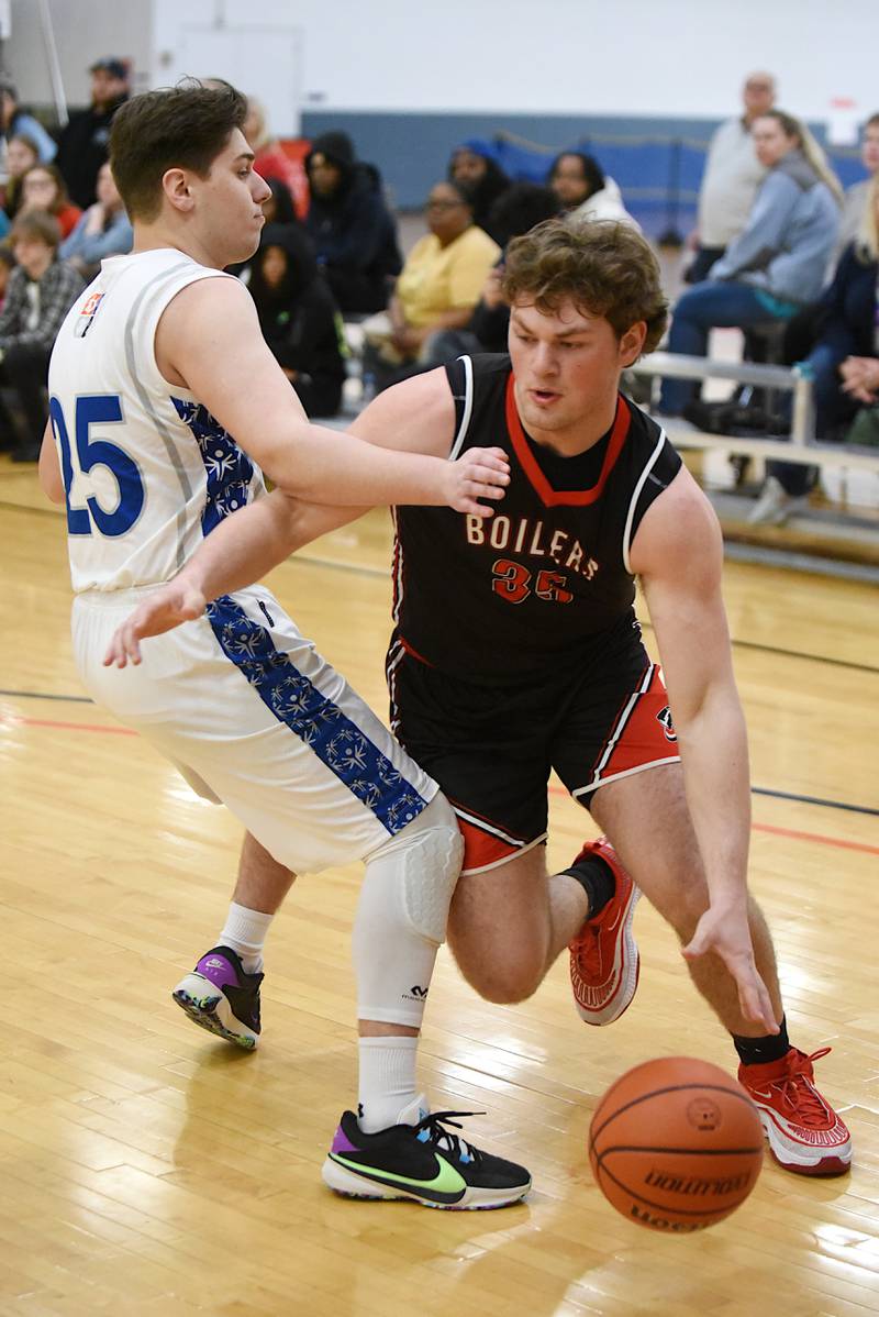 Bradley-Bourbonnais' Calvin Kohl, right, drives to the basket as Mt. Vernon's Marko Pastar defends during the IHSA Special Olympics Unified Basketball Division 1 State championship game at the University of Illinois Activities and Recreation Center March 15, 2025.