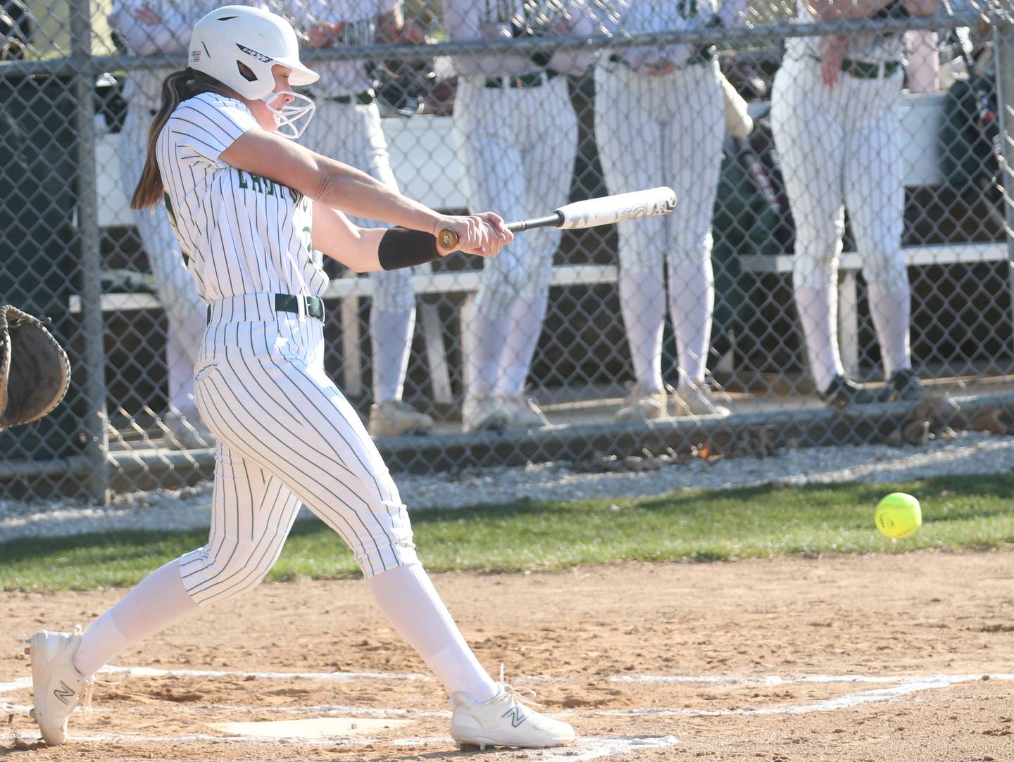 St. Bede's Ella Hermes smacks a hit against Midland on Thursday, March 21, 2024 at St. Bede Academy.