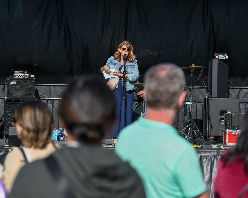 Christy Sopka of the Elmhurst City Center welcomes everyone who came out on Saturday May 31, 2025, during the Elmhurst Summer Kick Off Party held at City Centre Fountain Plaza in Elmhurst.