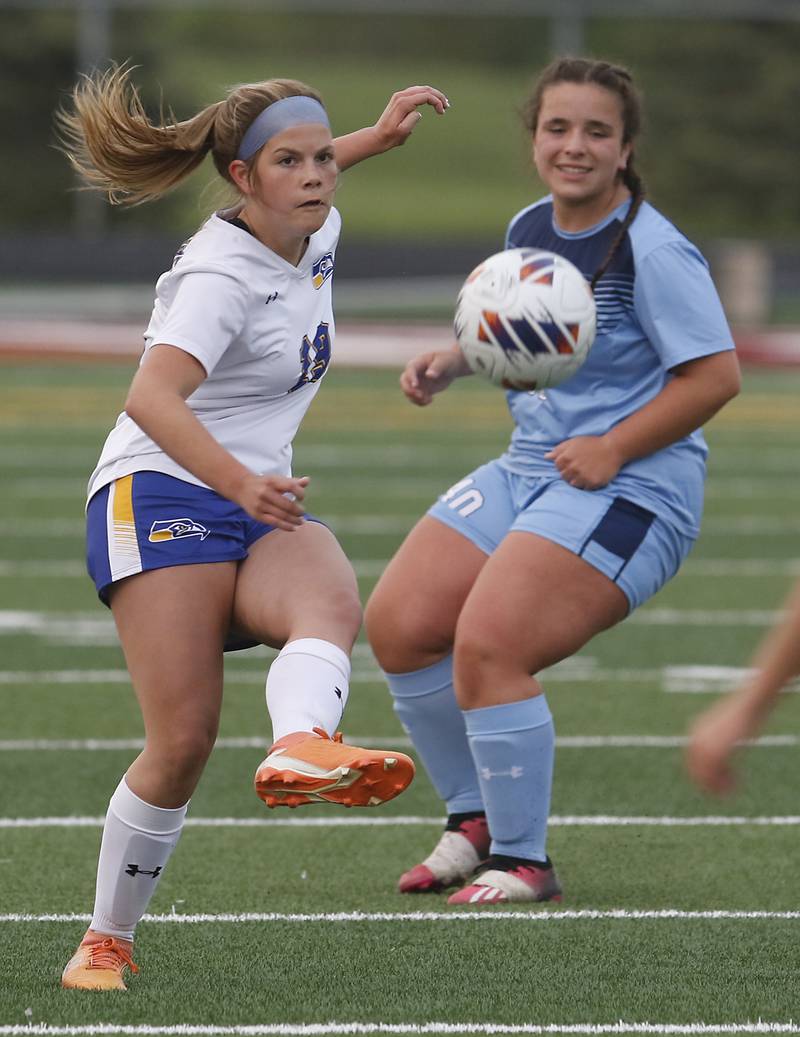 Johnsburg's Aliyah Andersen passes the ball as she is defended by Willows’ Lucia Castillo during a IHSA Division 1 Richmond-Burton Sectional semifinal soccer match Tuesday, May 16, 2023, at Richmond-Burton High School.