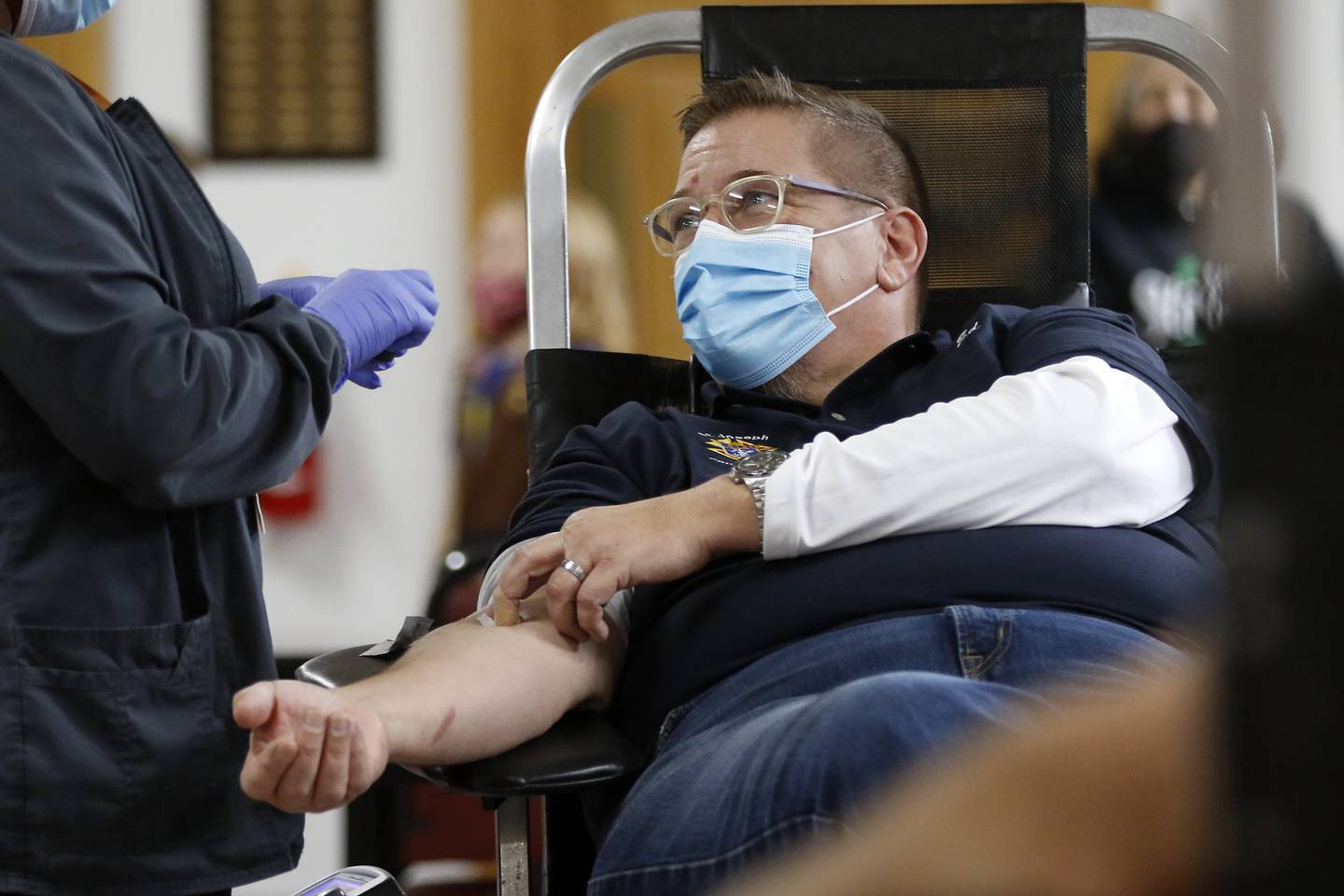 Edward Varga, of Richmond, has blood drawn by phlebotomist Katrina White during a Versiti blood drive hosted by the Knights of Columbus and Girl Scouts on Saturday, Nov. 20, 2021 at St. Joseph's Catholic Church in Richmond. A shortage in the blood supply has again resurged and blood drives are hopeful for donors.