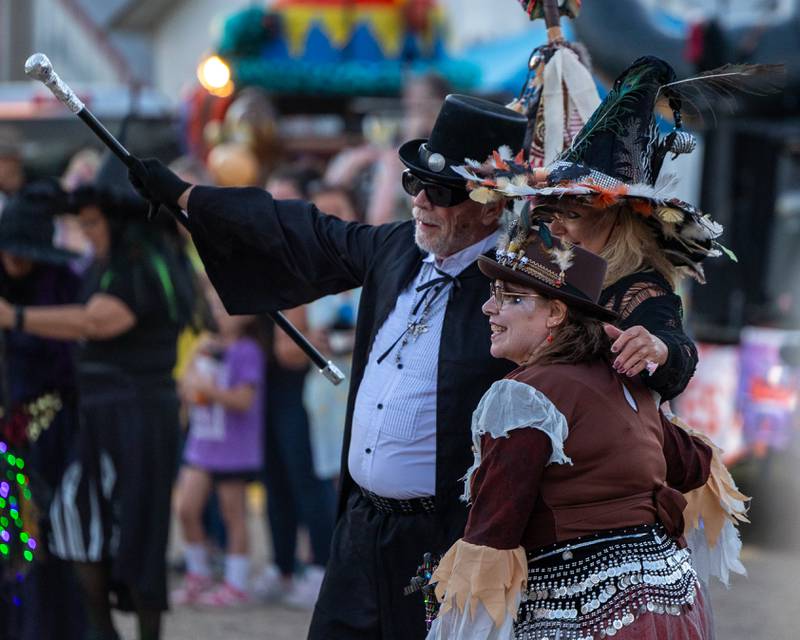 'Hocus Pocus Hags' hug during performance in front of crowd at the Monster Mash Balloon Bash on Saturday, Oct. 4, 2025 at the Bureau County Fairgrounds in Princeton.