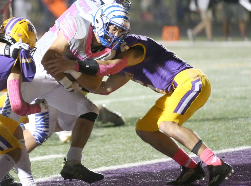 Princeton's Ace Christiansen runs in for a touchdown over Mendota's Corbin Furar on Friday, Oct. 11, 2024 at Mendota High School.