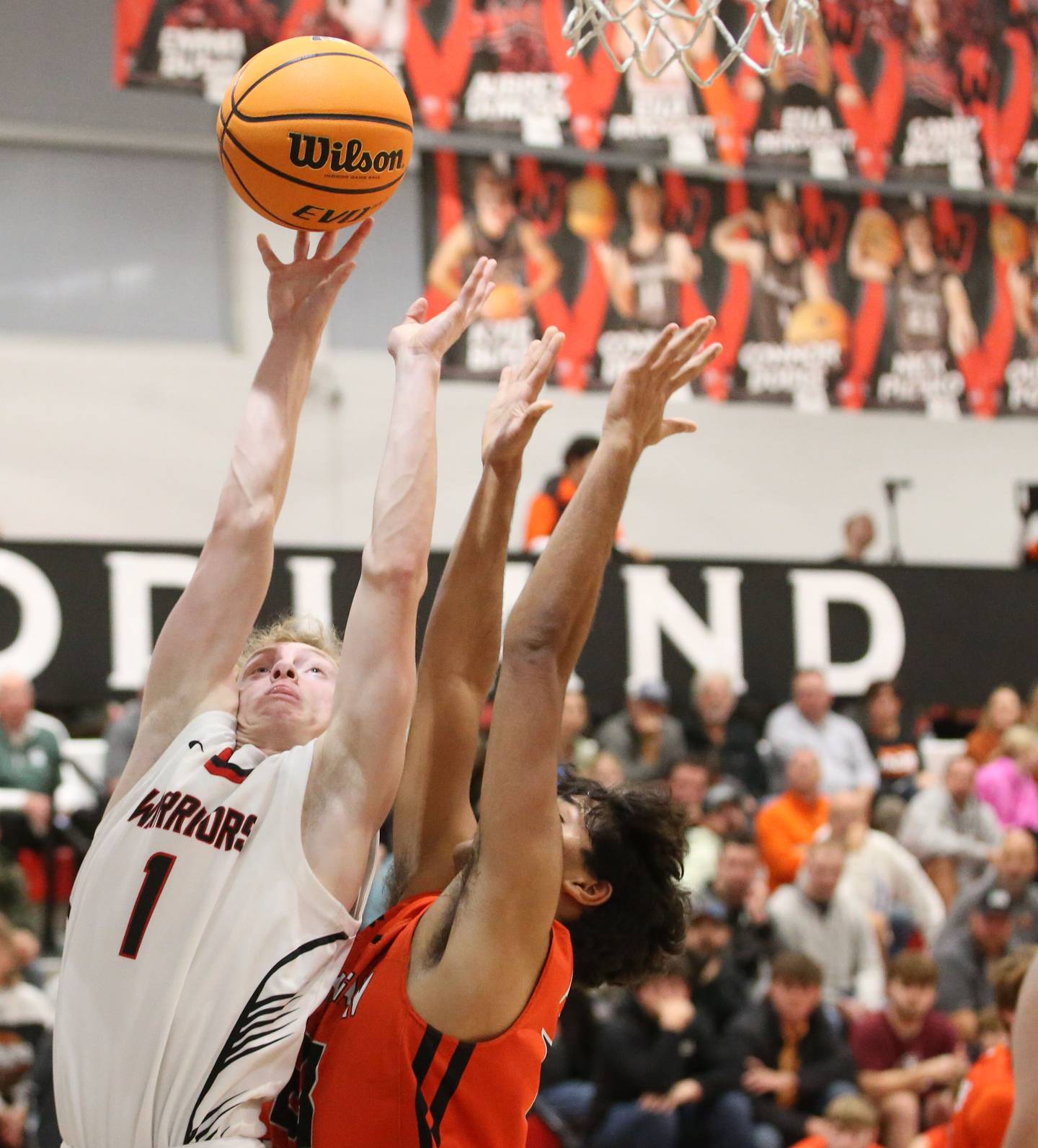 Woodland's Connor Dodge lets go of the ball under the hoop as Flanagan-Cornell's Rudra Patel defends during the Route 17 Classic Tournament on Wednesday, Nov. 27, 2024 at Woodland High School.