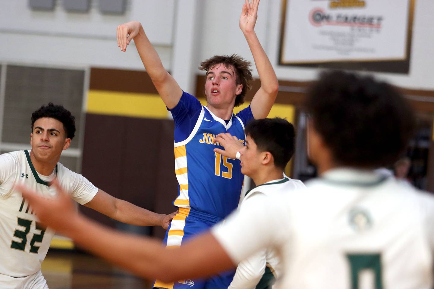 Johnsburg’s Ashton Stern applies the finishing touch on a three-point basket against Boylan in varsity boys basketball Hinkle Holiday Classic action on Tuesday, Dec. 23, 2025, at Jacobs High School in Algonquin.