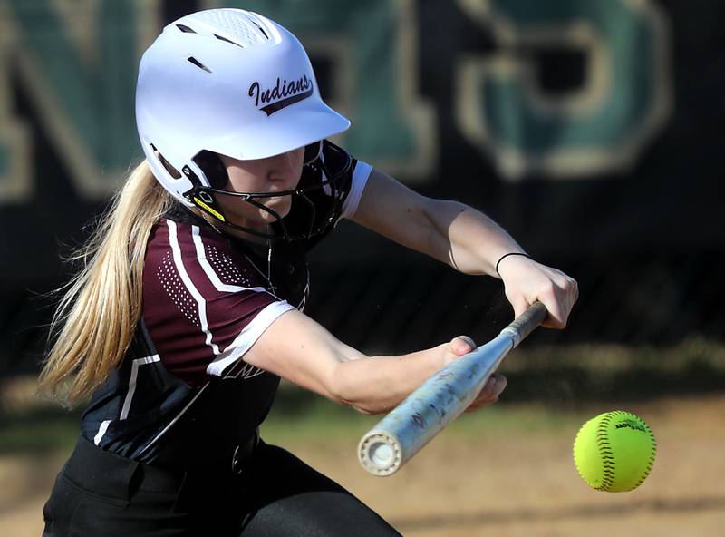 Marengo's Lily Lindner lays down a bunt during a Kishwaukee River Conference softball game against Woodstock North on Tuesday, April 28 , 2026, at Woodstock North High School.