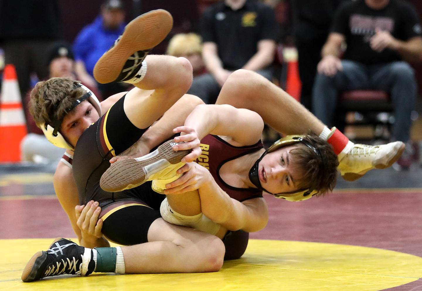 Marengo’s Hayden Beebe battles with Richmond-Burton’s Wyatt Franckowiak during a 132-pound match of in the Tom DuBois Invite wrestling meet on Saturday, Dec. 13, 2025, at Richmond-Burton High School in Richmond.