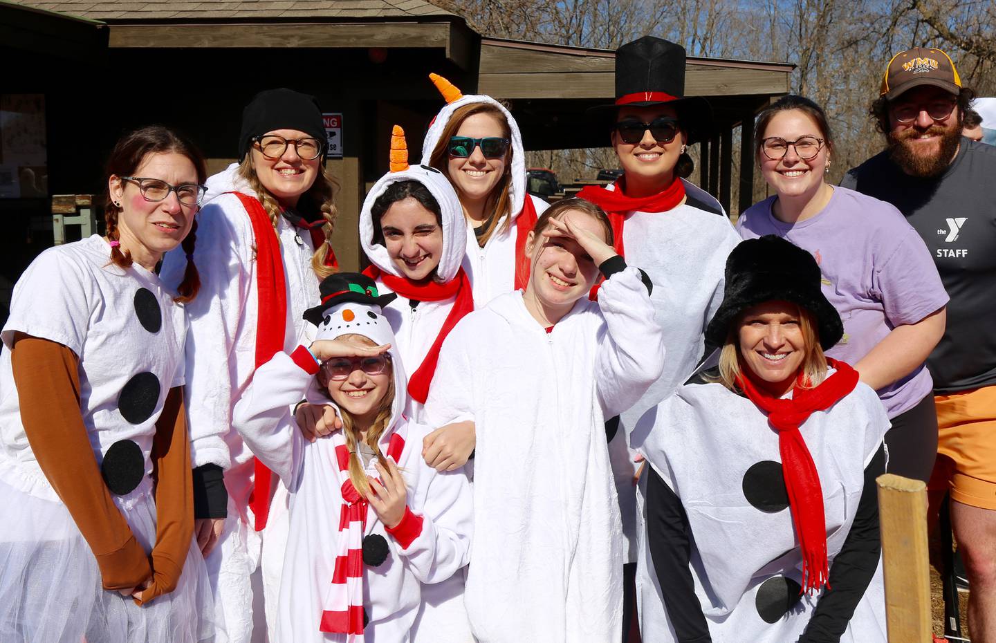 Frosty Force from the Kendall County Health Department pose for a photo before they take the plunge at the Yorkville Polar Plunge on Sunday, March 2, 2025.