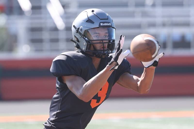 Minooka Wideout Donavan Anderson catches a pass during practice. Wednesday, Aug. 10, 2022, in Minooka.