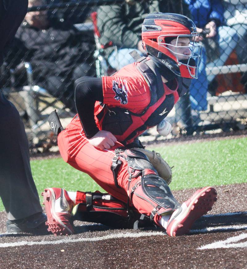 Erie-Prophetstown catcher Parker Rangel blocks a pitch with his chest guard during action against Sterling on Saturday, March 22, 2025 at Gartner Park in Sterling.