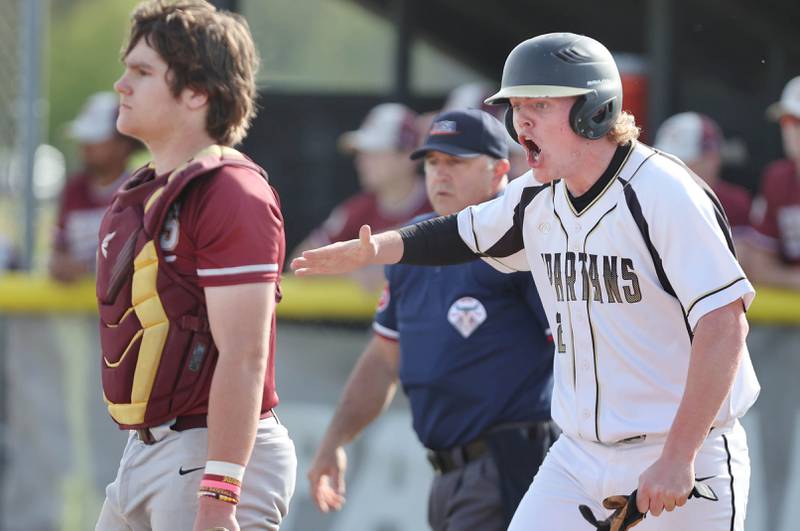 Sycamore's Jimmy Amptmann is fired up after scoring a run during their game against Morris Tuesday, May 9, 2023, at the Sycamore Community Sports Complex.