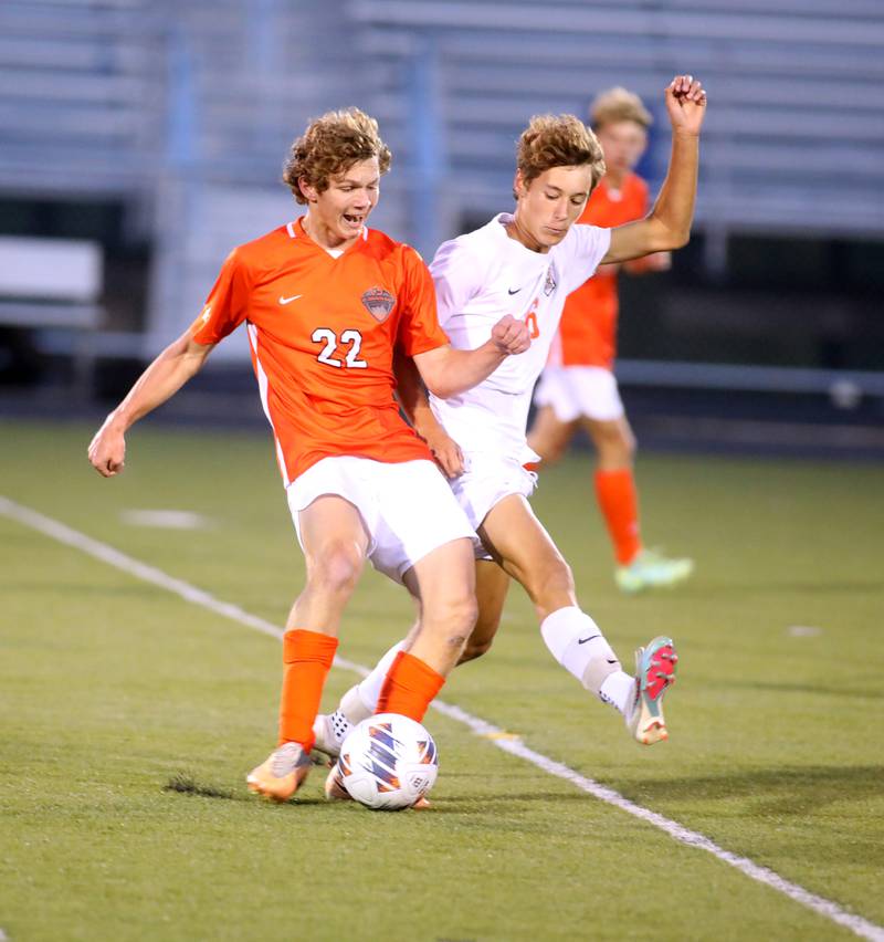 St. Charles East’s Garrett Melton (left) gets control of the ball away from Crystal Lake Central’s Nicholas Pagonis during a game at Streamwood on Tuesday, Sept. 12, 2023.