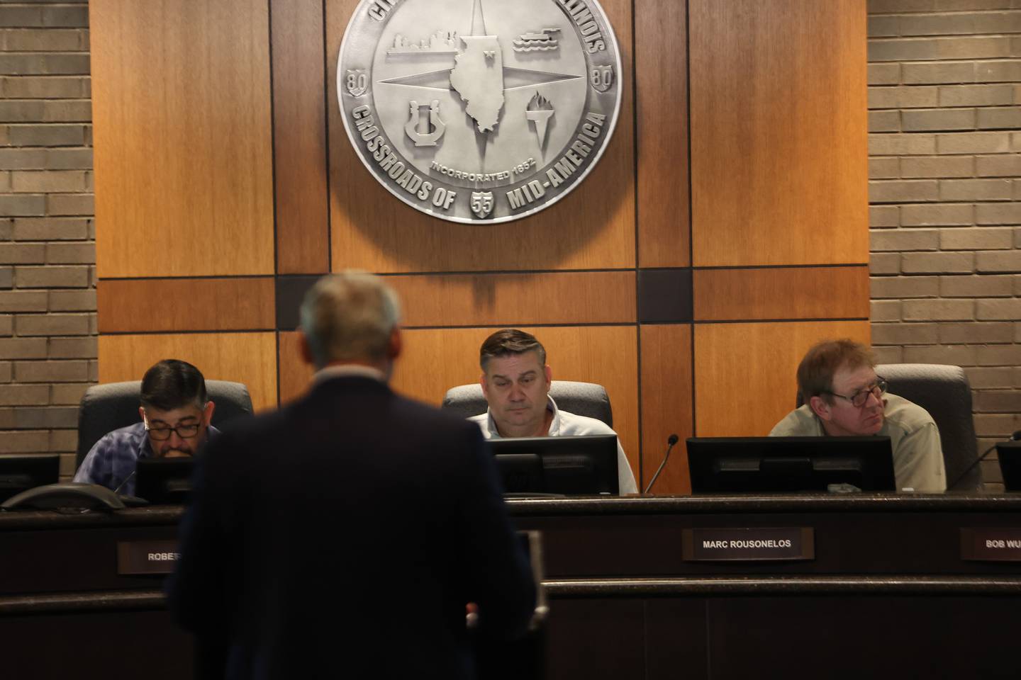 Board members Roberto Perez, left, Jason Cox and Marc Rousonelos listen toAttorney Chris Spesia speak at the Joliet Plan Commission meeting. Thursday, April 21, 2022, in Joliet.