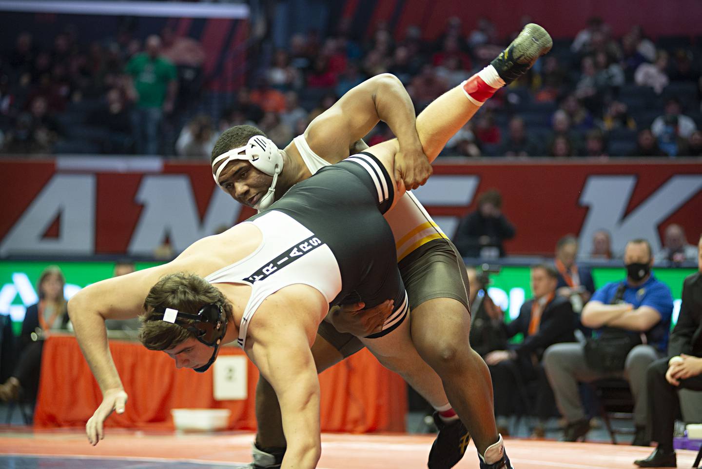 Dillan Johnson of Joliet Catholic throws Fenwick's Jimmy Liston in the 285lb 2A finals match at the IHSA state wrestling meet on Saturday, Feb. 19, 2022.