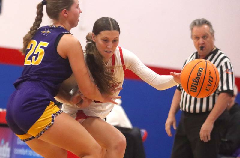 Huntley’s Evelyn Freundt drives with the ball against Hononegah in girls basketball at Dundee-Crown High School in Carpentersville on Tuesday, November 25, 2025.