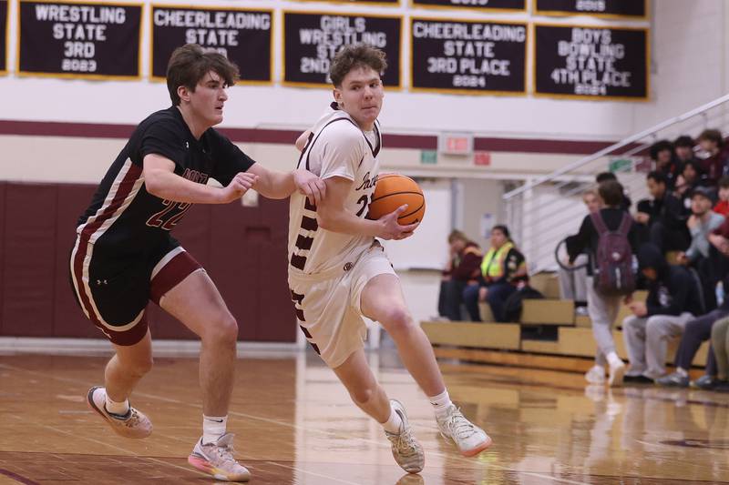 Lockport’s Collin Miller drives to the paint against Plainfield North on Friday, Jan. 3, 2025 in Lockport