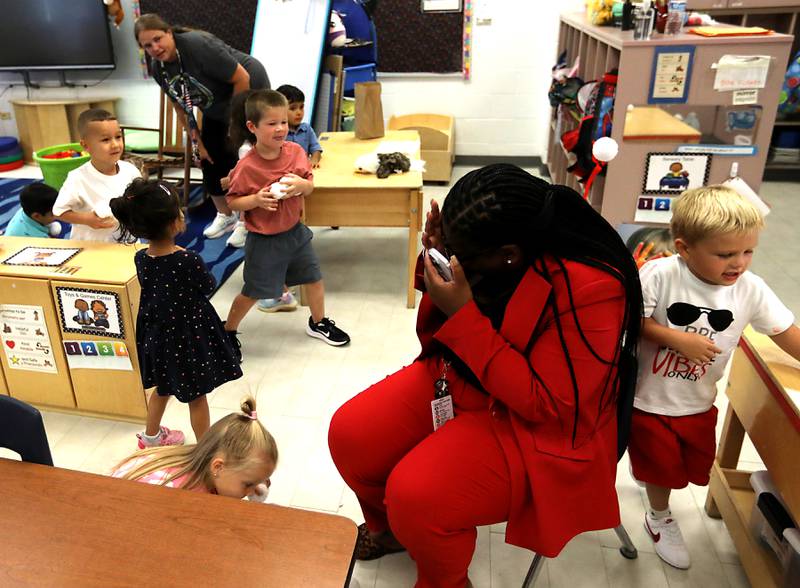 District 300 Superintendent Martina Smith dodges snowballs tossed by preschoolers during the first day of school on Tuesday, Aug. 12, 2025, at District 300's Westfield Community School in Algonquin.