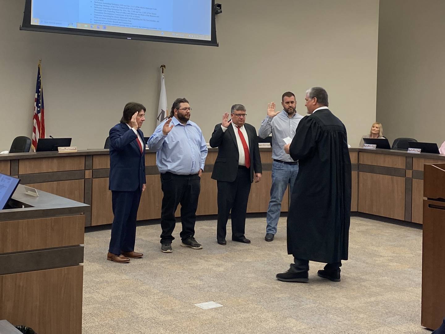 Morris Alderman Jim Black, Alex Clubb, Dean Tambling and Jake Duvick take their oaths of office in front of Judge Scott Belt.
