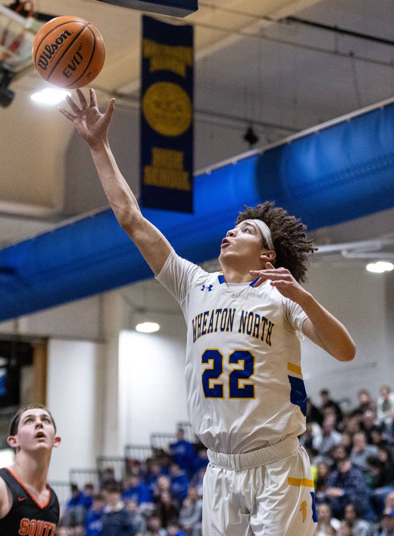 Wheaton North’s Sean Pedersen goes up for a layup during a game against Wheaton Warrenville South on Friday, Dec. 20, 2024.
