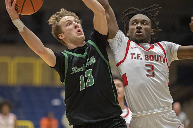 Rock Falls’ Aydan Goff works below the basket against Thornton Fractional South’s Sam Townsend Monday, Jan. 15, 2024 during Sterling High School’s MLK Classic basketball tournament.