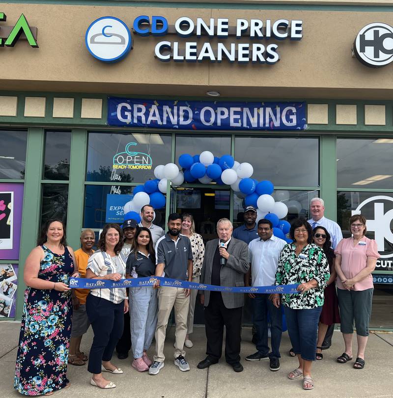 Batavia Mayor Jeffery Schielke celebrates the grand opening of CD One Price Cleaners with co-owners Lalo Patal and Jaitin Patel, and manager Kushi Patel.