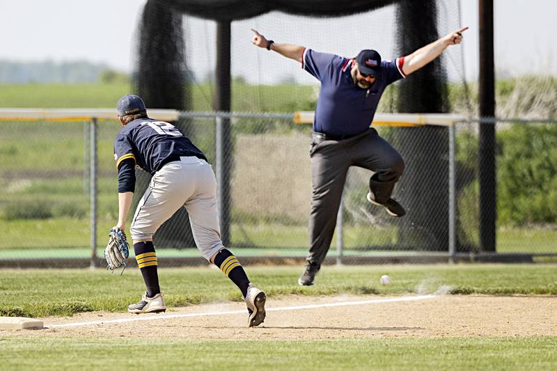 An umpire avoids a hit on a fair ball Monday, May 22, 2023 in a regional game between Sterling and Rochelle.