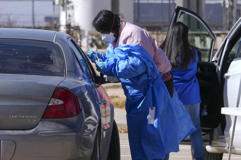 FILE - A health worker administers a measles test on Fernando Tarin, of Seagraves, Texas, at a mobile testing site outside Seminole Hospital District, Friday, Feb. 21, 2025, in Seminole, Texas. (AP Photo/Julio Cortez, File)